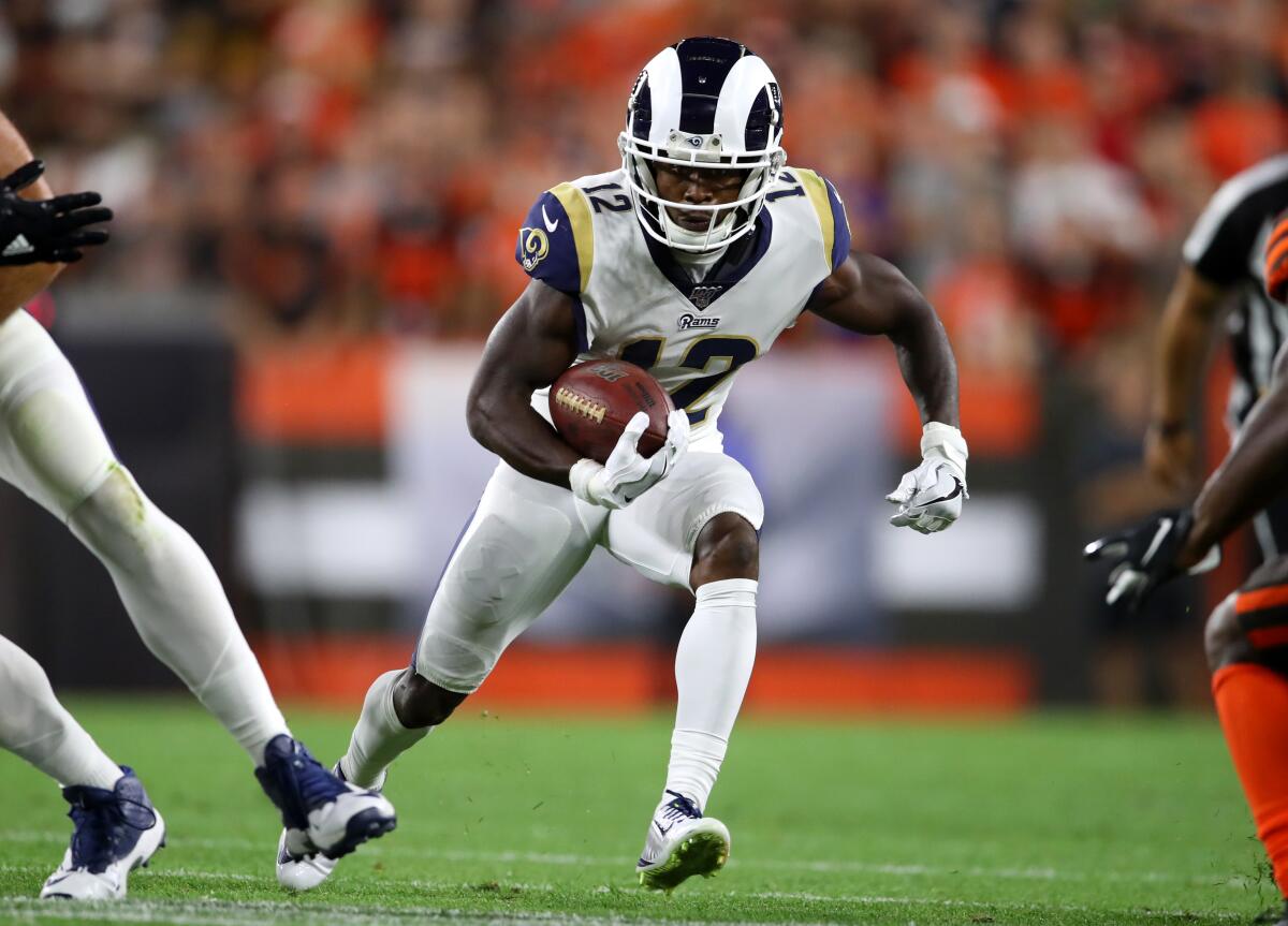 Rams wide receiver Brandin Cooks carries the ball.