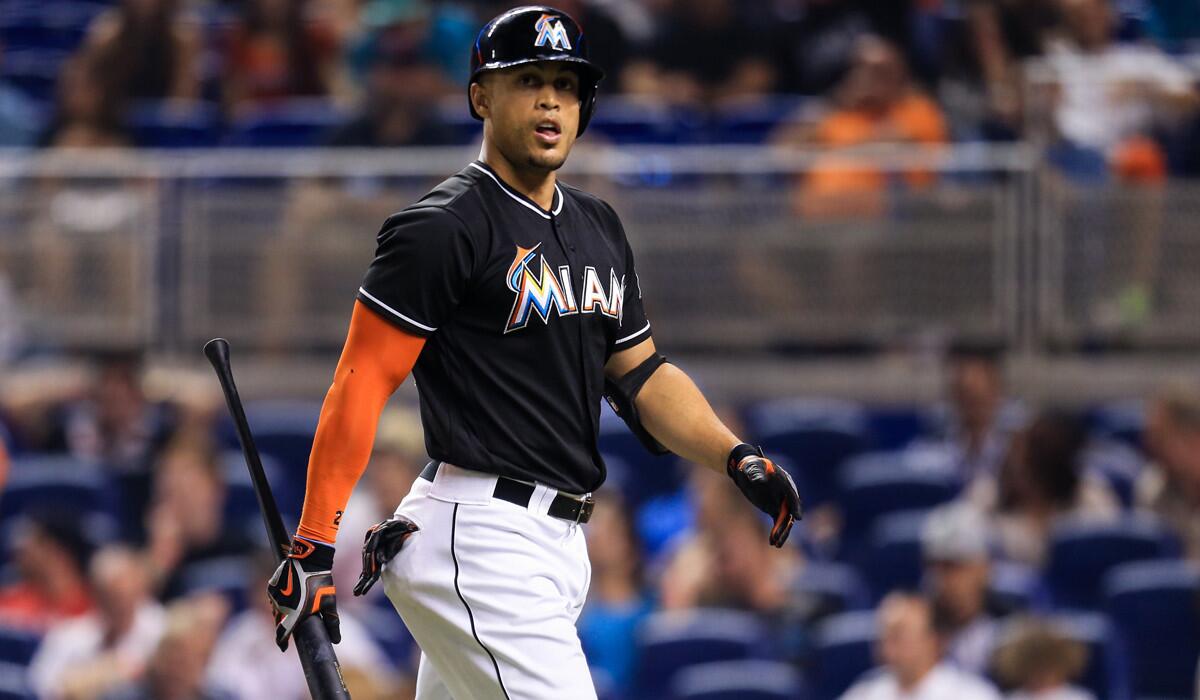 Miami Marlins' Giancarlo Stanton reacts after striking out to end the fifth inning against the Washington Nationals on Saturday.