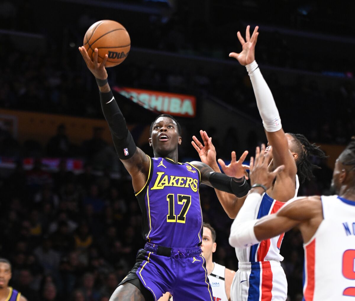 Lakers guard Dennis Schroder drives to the basket against the Pistons.