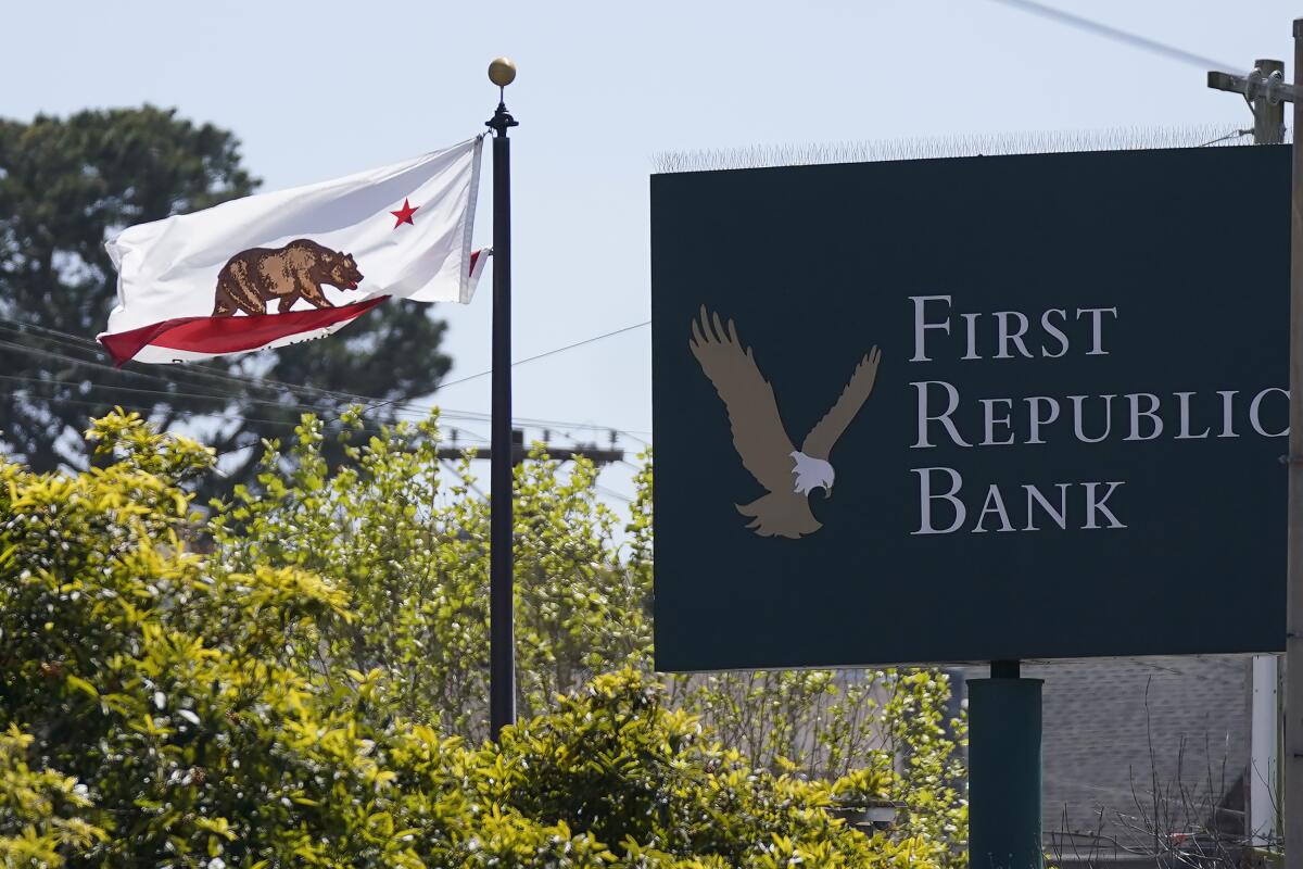 A sign for First Republic Bank with a California flag.