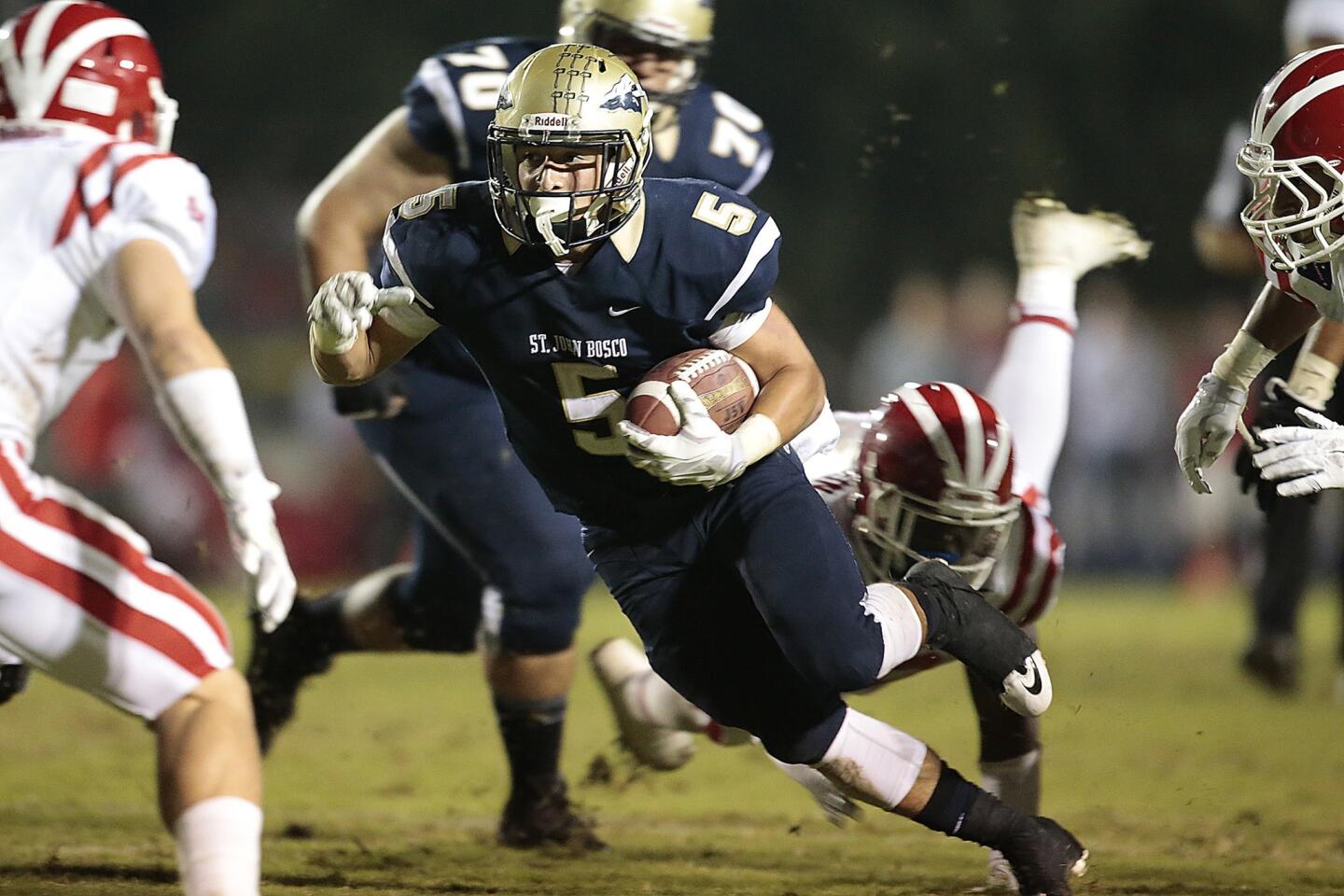 St. John Bosco running back Sean McGrew carries the ball during the second quarter of Friday's game against Mater Dei.