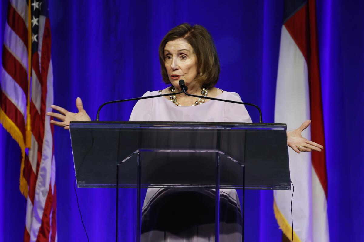 Former House Speaker Nancy Pelosi speaks from a lectern at a fundraiser in Raleigh, N.C.