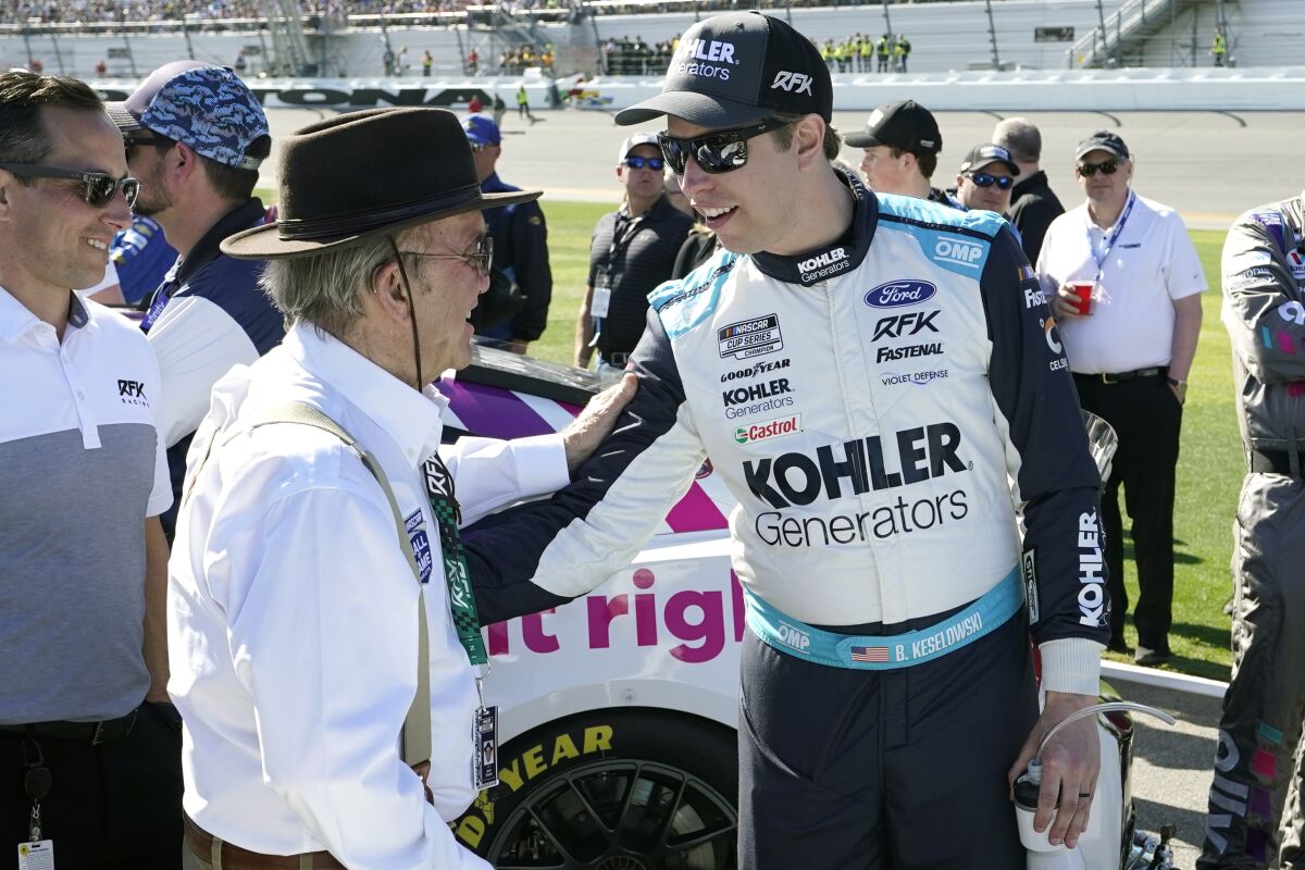 FILE - Car owner Jack Roush, left, greets Brad Keselowski on pit road before the start of the NASCAR Daytona 500 auto race at Daytona International Speedway, Sunday, Feb. 20, 2022, in Daytona Beach, Fla. The best thing to happen to rebranded RFK Racing came exactly a year ago when NASCAR discovered an illegal part on Brad Keselowski's car. The crippling penalty that followed was the spark the organization needed for a complete overhaul spearheaded in large part by Keselowski, who had left the comforts of Team Penske to become a part-owner of Jack Roush's once-proud organization. (AP Photo/John Raoux, File)