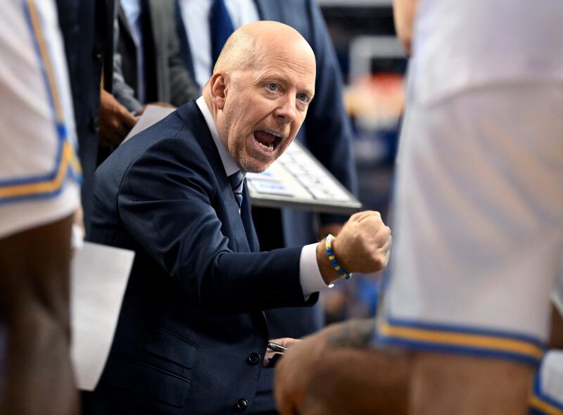 UCLA coach Mick Cronin shouts instructions to his players during a timeout.