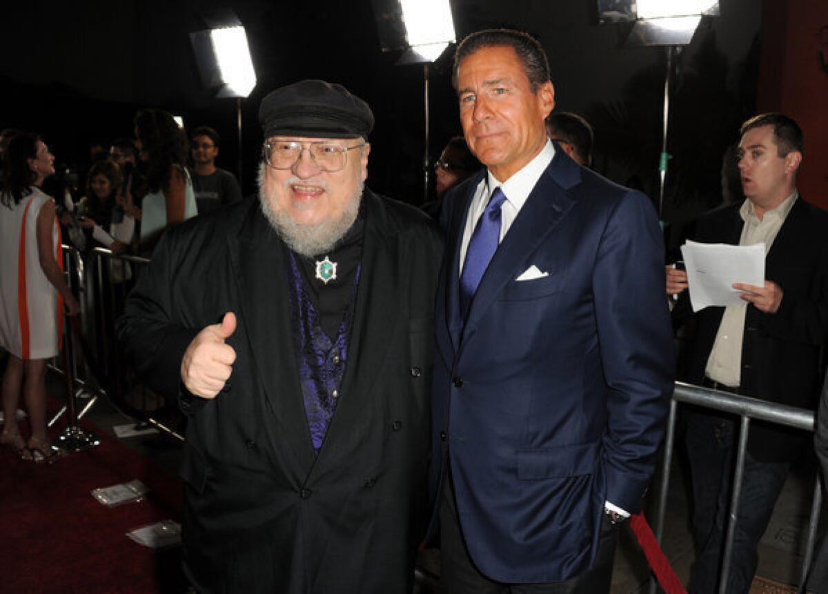 HBO Chief Executive Richard Plepler, right, and George R.R. Martin, co-executive producer of "Game of Thrones," arrive at the premiere of the series' third season at TCL Chinese Theatre in Hollywood.