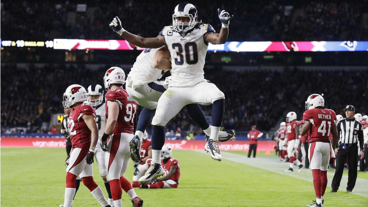 Rams running back Todd Gurley (30) celebrates after scoring a touchdown during the first half against the Arizona Cardinals on Oct. 22 in London.