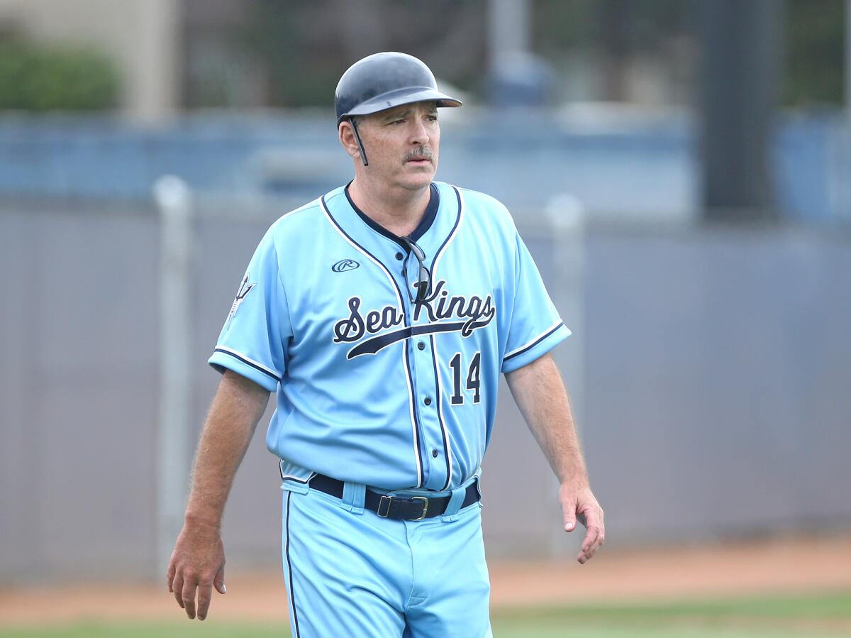 Longtime Corona del Mar baseball coach John Emme, shown after managing his last game for the Sea Kings in 2018, died Monday. 