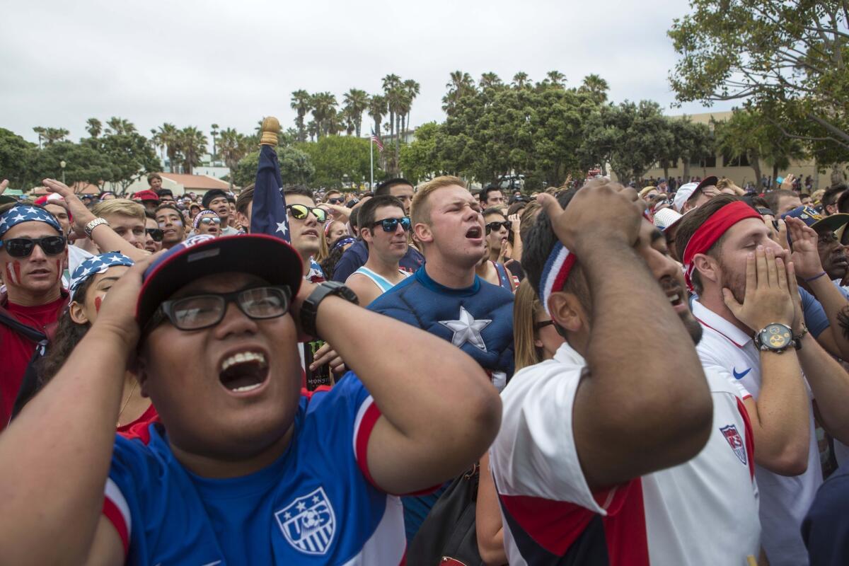 U.S. soccer fans at Redondo Beach Pier react while watching their team in a losing effort against Belgium in the World Cup last month.