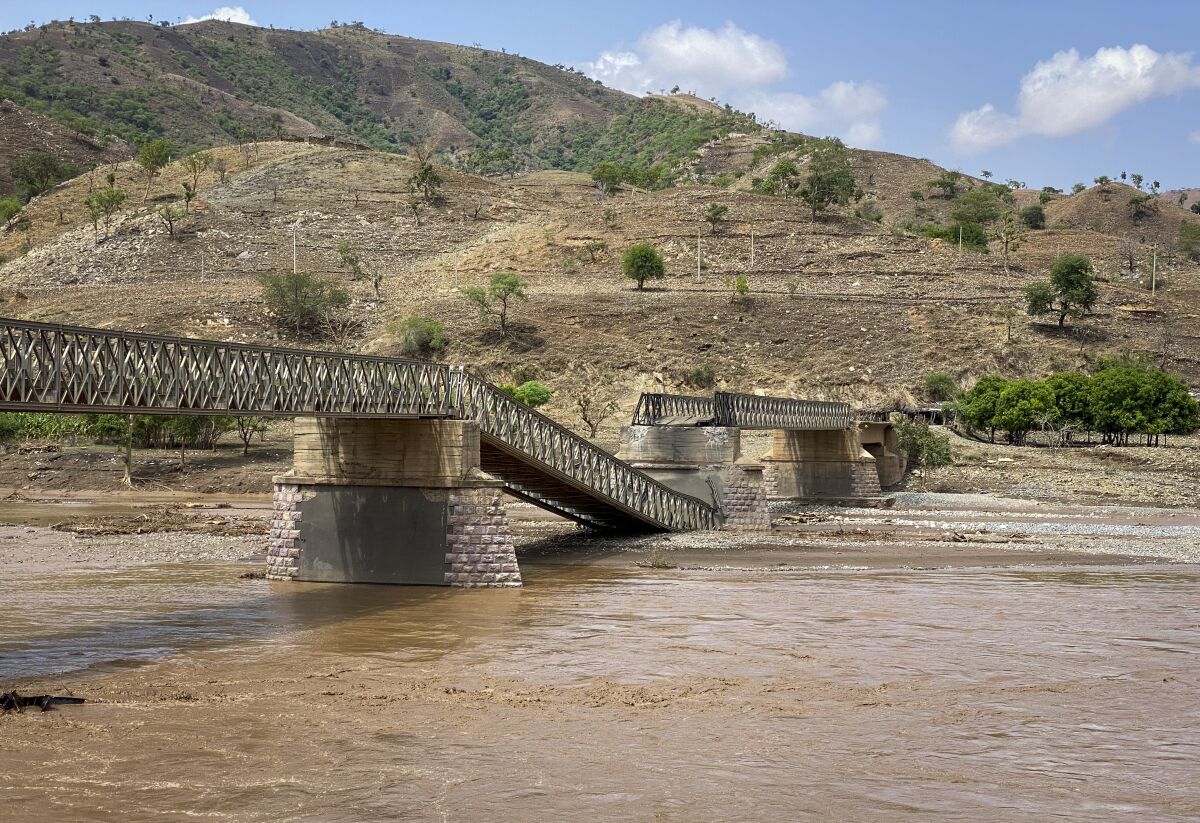 A destroyed bridge over the Tekeze River is seen in the Tigray region of northern Ethiopia Thursday, July 1, 2021. The bridge on a main supply route linking western Tigray that is crucial to delivering desperately needed food to much of Ethiopia's embattled Tigray region has been destroyed, aid groups said Thursday. (Roger Sandberg/Medical Teams International via AP)