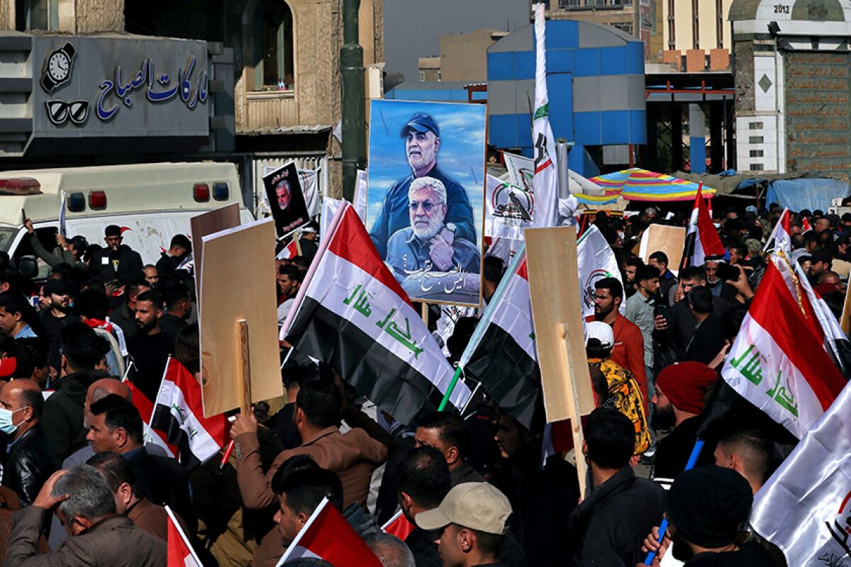 Rally in Baghdad marking the one-year anniversary of the deaths of an Iranian general and top Iraqi militia leader.