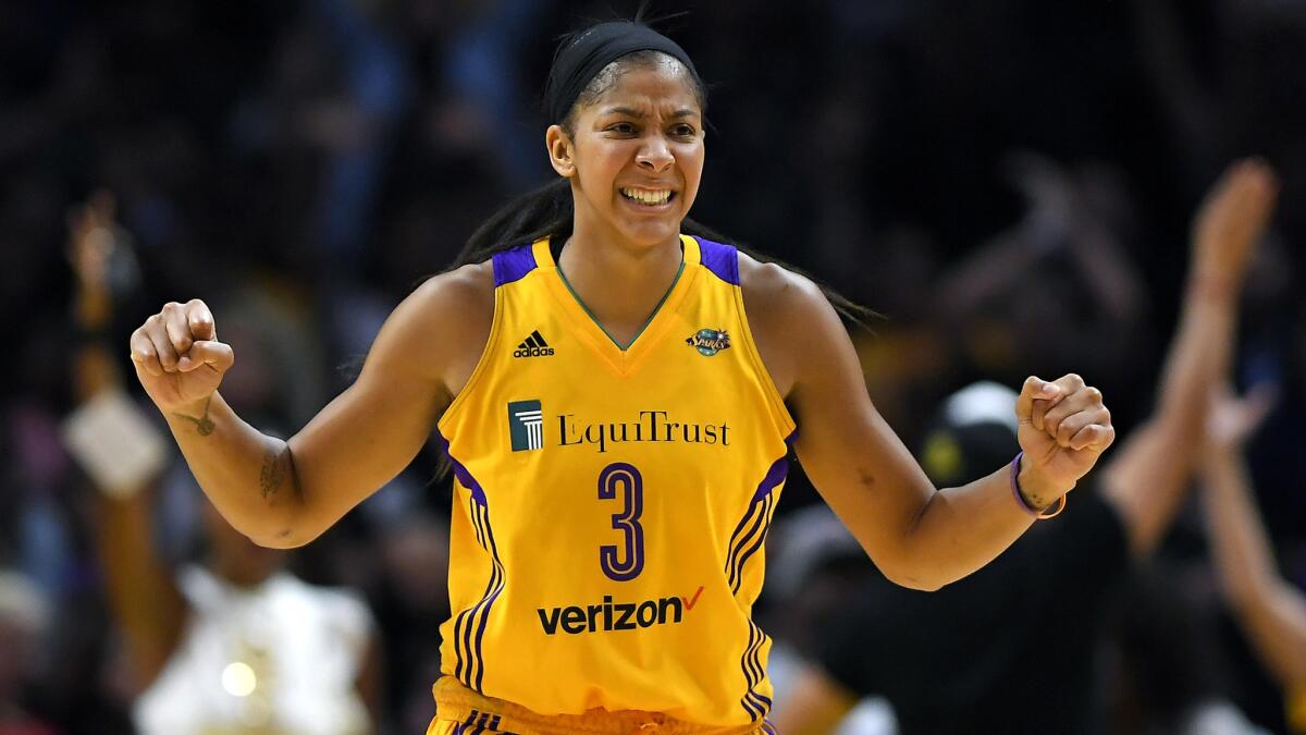 Candace Parker celebrates during the Sparks' Game 3 victory in the WNBA Finals against the Minnesota Lynx, which moved them to within one win of back-to-back titles.