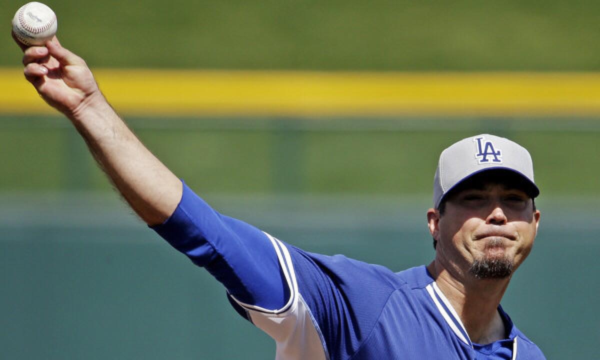 Dodgers pitcher Josh Beckett throws during a Cactus League game against the Chicago Cubs on March 14. Beckett had his best start of spring training Thursday.