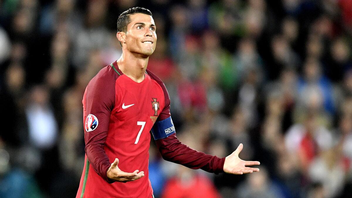 Portugal forward Cristiano Ronaldo reacts after missing a penalty kick against Austria on Saturday.