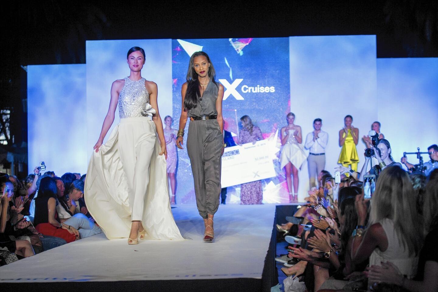 Francesca Lake, right, the winner of the Celebrity Cruises Design Competition, walks the runway during Style Week Orange County.