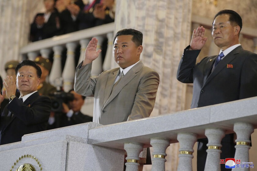 In this photo provided by the North Korean government, North Korean leader Kim Jong Un, center, waves from a balcony toward the assembled troops and spectators during a celebration of the nation’s 73rd anniversary at Kim Il Sung Square in Pyongyang, North Korea, early Thursday, Sept. 9, 2021. Independent journalists were not given access to cover the event depicted in this image distributed by the North Korean government. The content of this image is as provided and cannot be independently verified. Korean language watermark on image as provided by source reads: "KCNA" which is the abbreviation for Korean Central News Agency. (Korean Central News Agency/Korea News Service via AP)