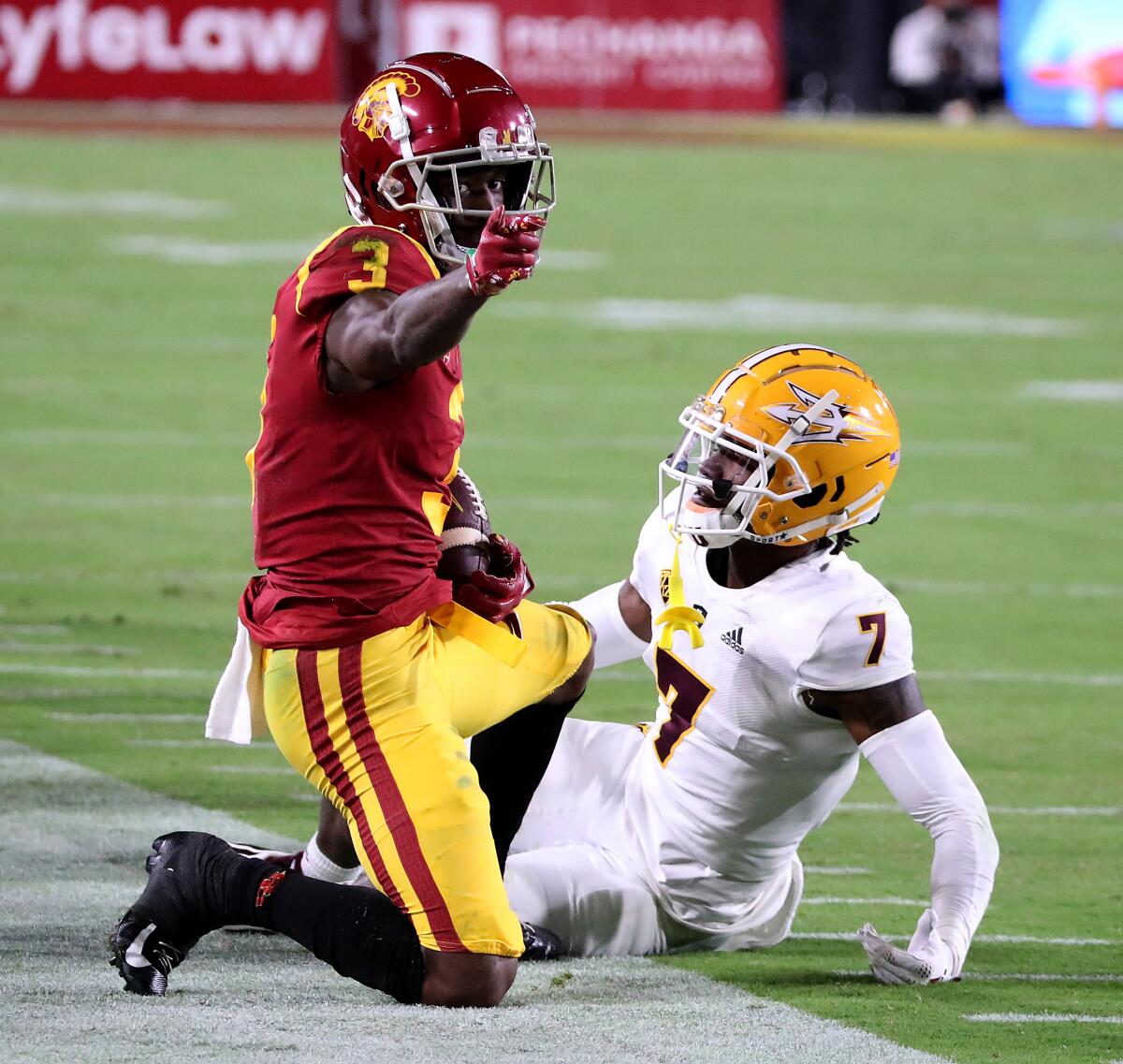 USC wide receiver Jordan Addison signals for a first down after making a catch against Arizona State's Timarcus Davis.