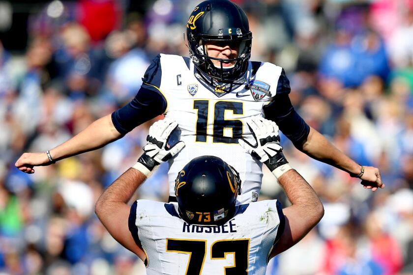 California quarterback Jared Goff (16) is hoisted aloft by teammate Jordan Rigsbee after throwing a touchdown pass against Air Force in the second half Tuesday.