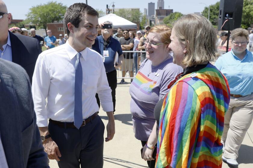 Democratic presidential candidate Pete Buttigieg greets locals residents during the Capital City Pride Fest, Saturday, June 8, 2019, in Des Moines, Iowa. (AP Photo/Charlie Neibergall)