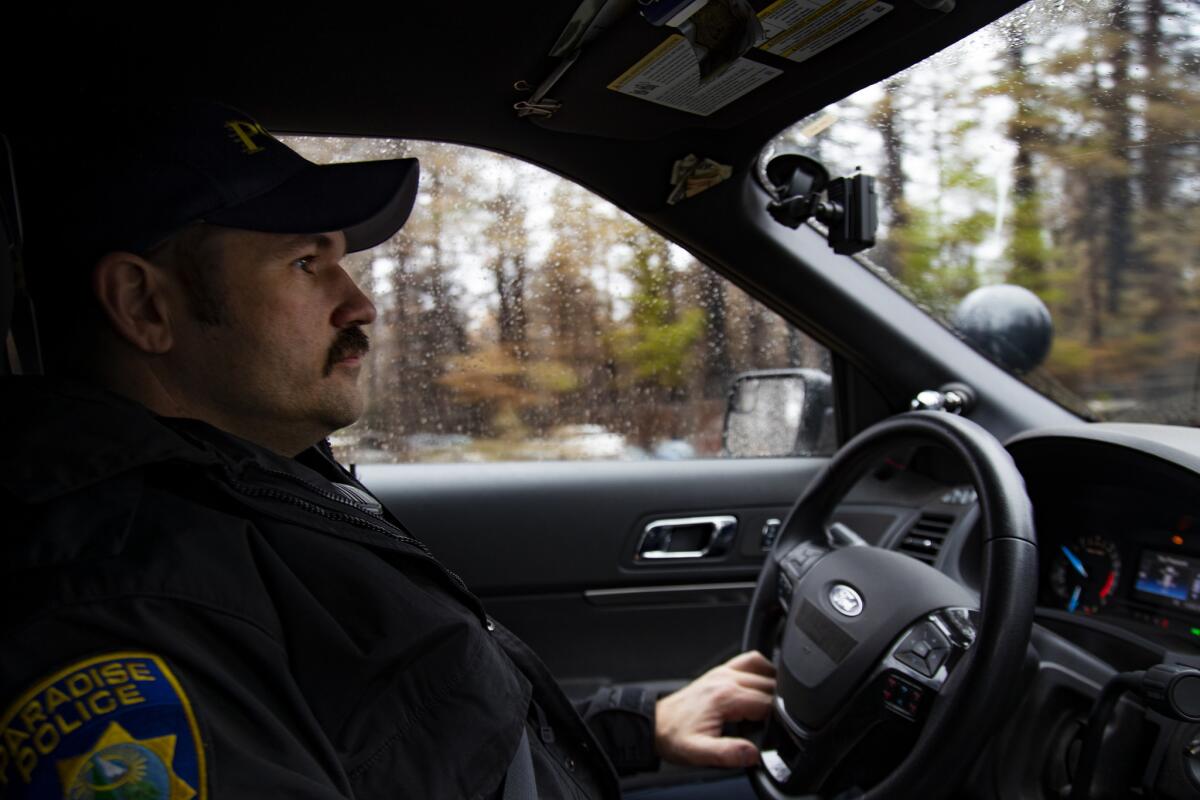 Paradise Police Officer Perry Walters patrols the town's devastated streets.