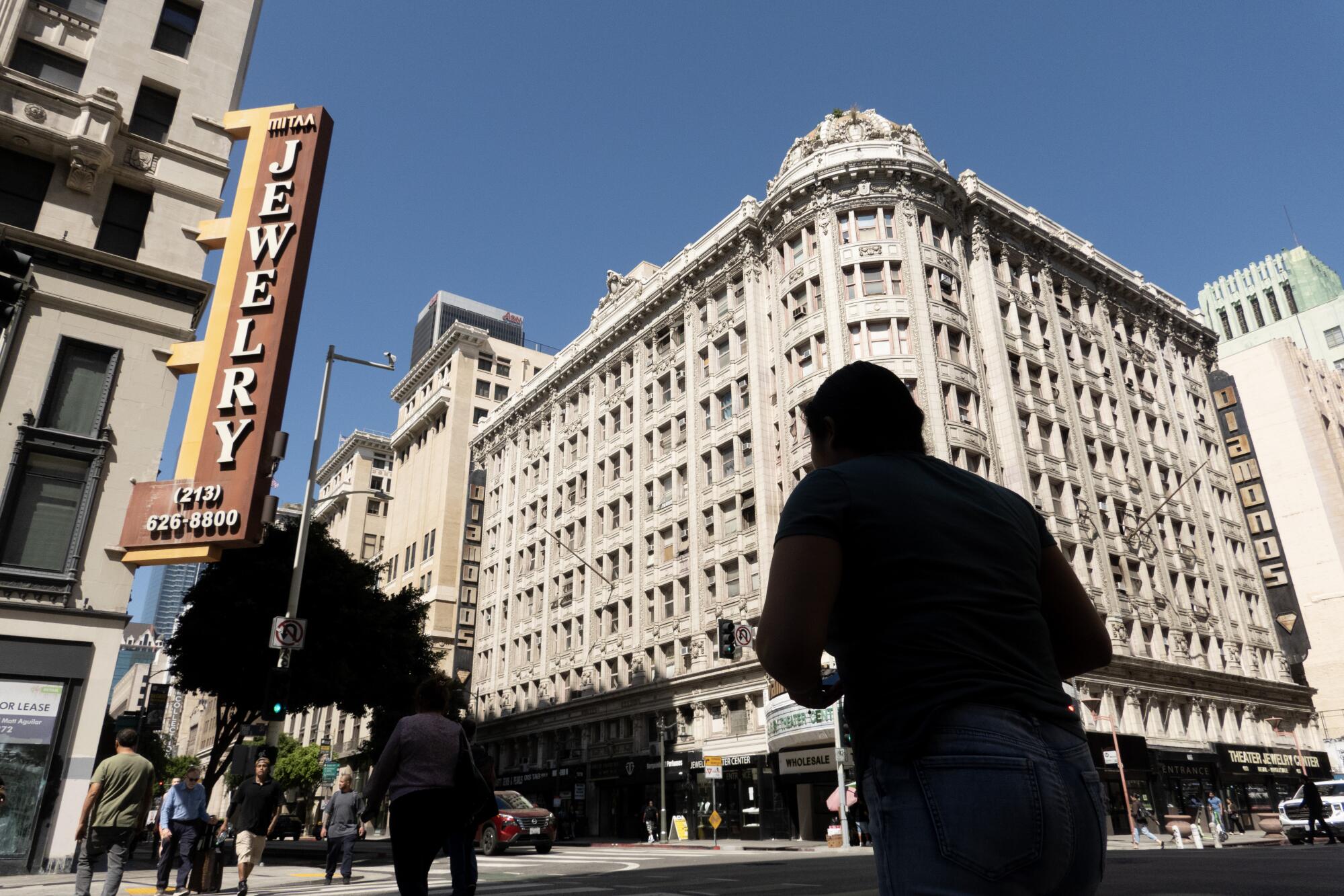 Buildings, with one carrying a vertical sign that says "Jewelry."