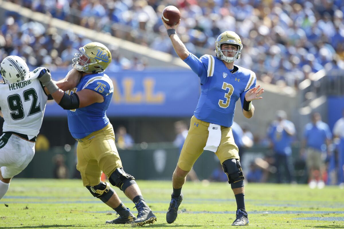 UCLA quarterback Josh Rosen leads the Bruins on a second quarter touchdown drive against Hawaii at the Rose Bowl.