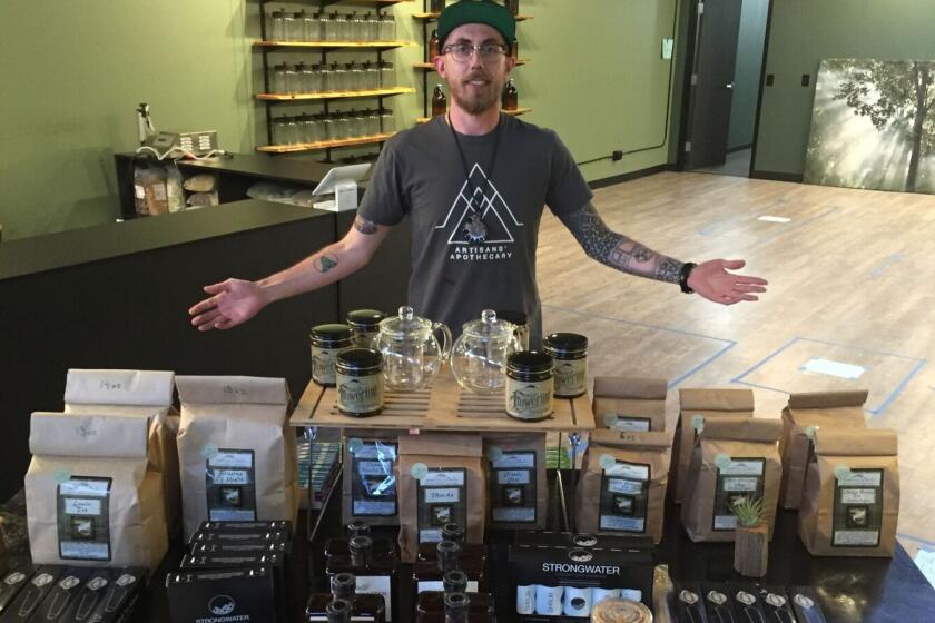 Jeremy Haley, 30, stands inside the Artisan's Apothecary in Denver, where he hopes to sell kratom, a plant used to treat drug addiction and other ailments.