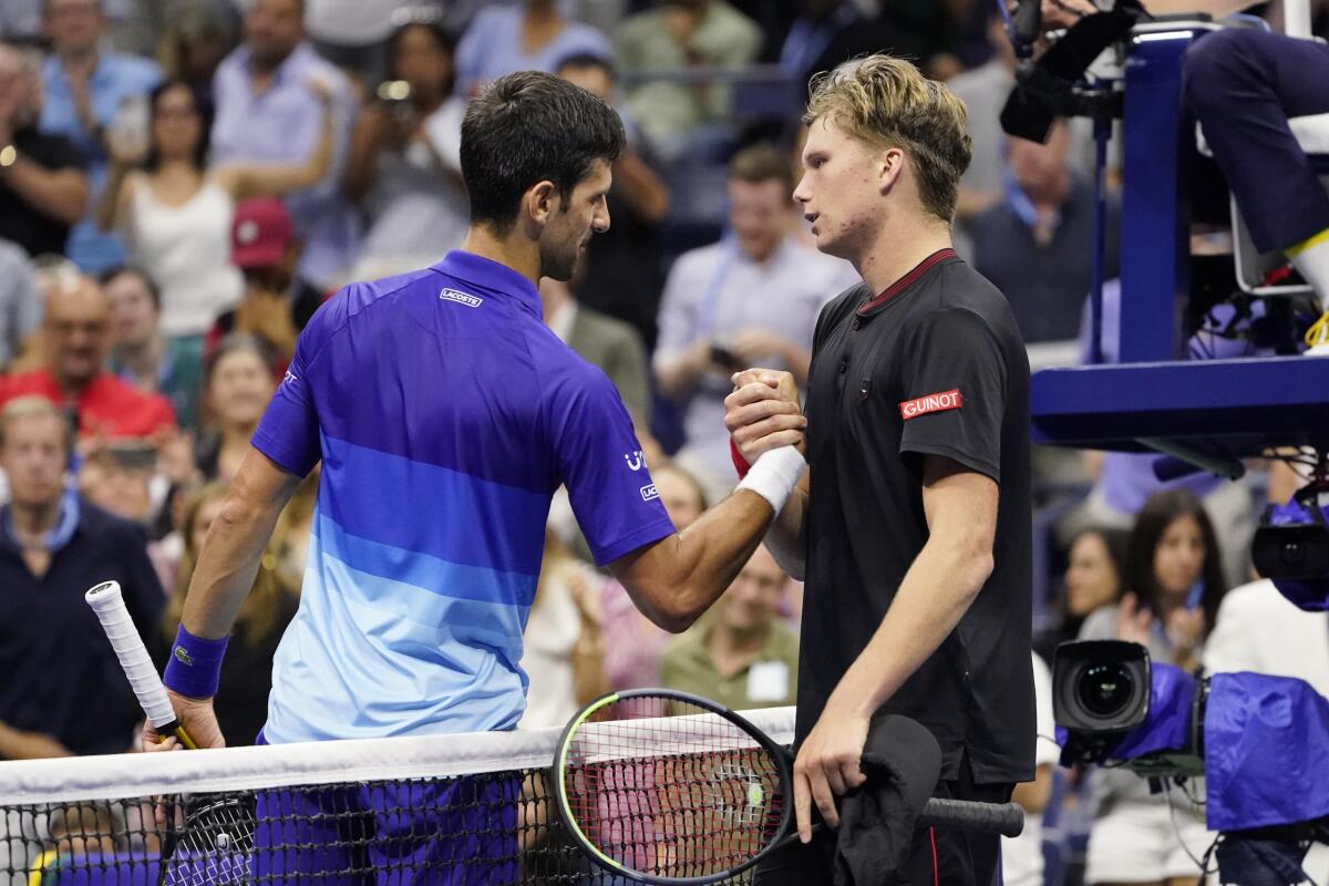 Novak Djokovic greets Jenson Brooksby after beating Brooksby during the fourth round of the U.S. Open.