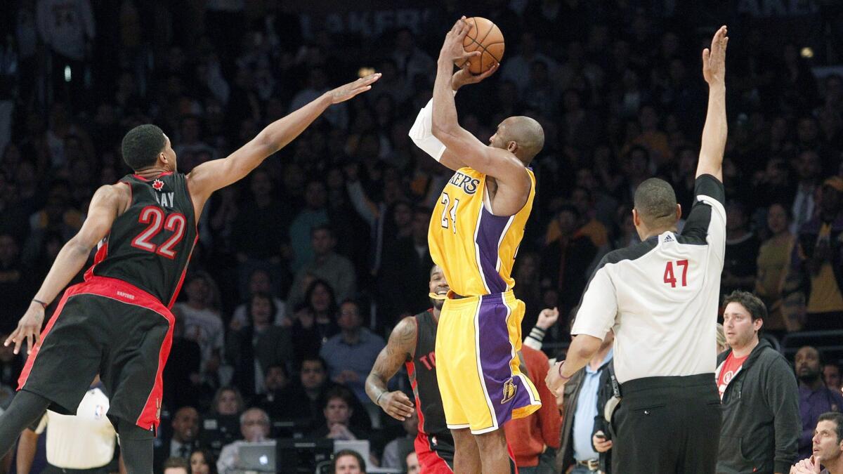 Kobe Bryant takes a three-point shot that ties the score at the end of the fourth quarter against the Toronto Raptors.