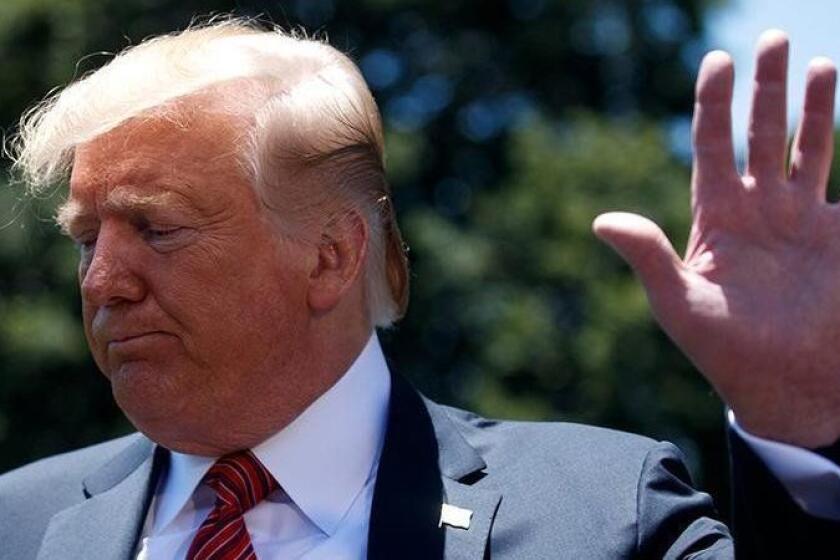 President Donald Trump walks away after speaking to reporters before departing for a trip to Iowa, on the South Lawn of White House, Tuesday, June 11, 2019, in Washington. (AP Photo/Evan Vucci)