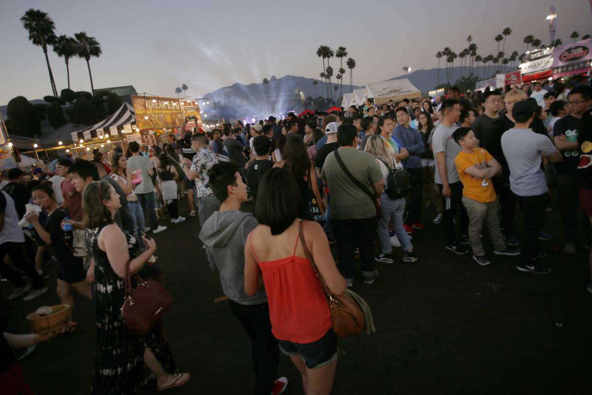 A large crowd attends the 626 Night Market in Arcadia during its opening weekend in 2017. (Francine Orr / Los Angeles Times)