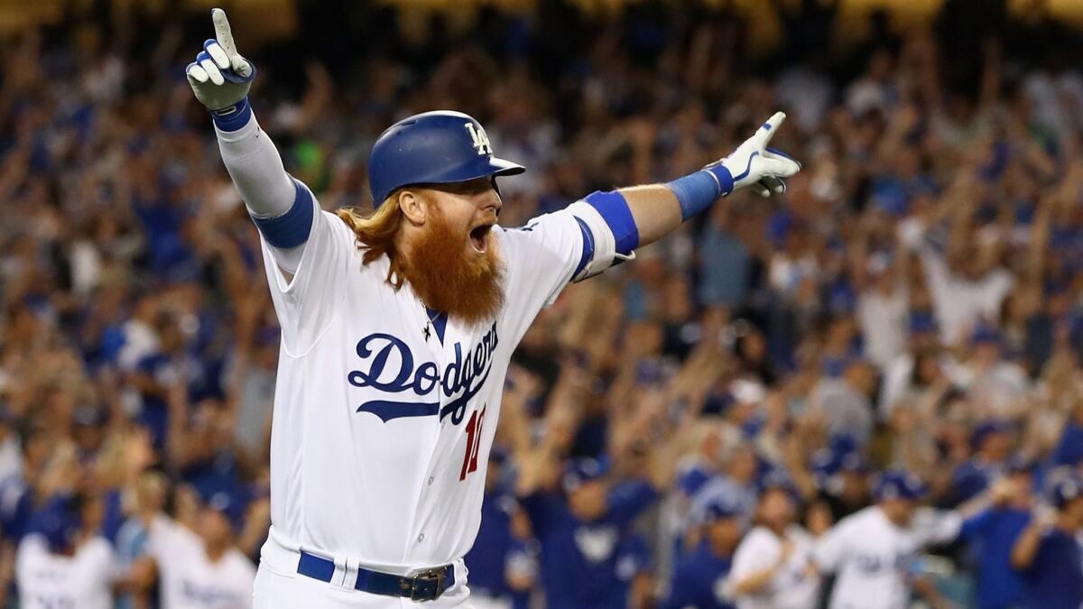 On the 29th anniversary of Kirk Gibson's famous walk-off home run, Justin Turner celebrates after beating the Chicago Cubs with his home run.