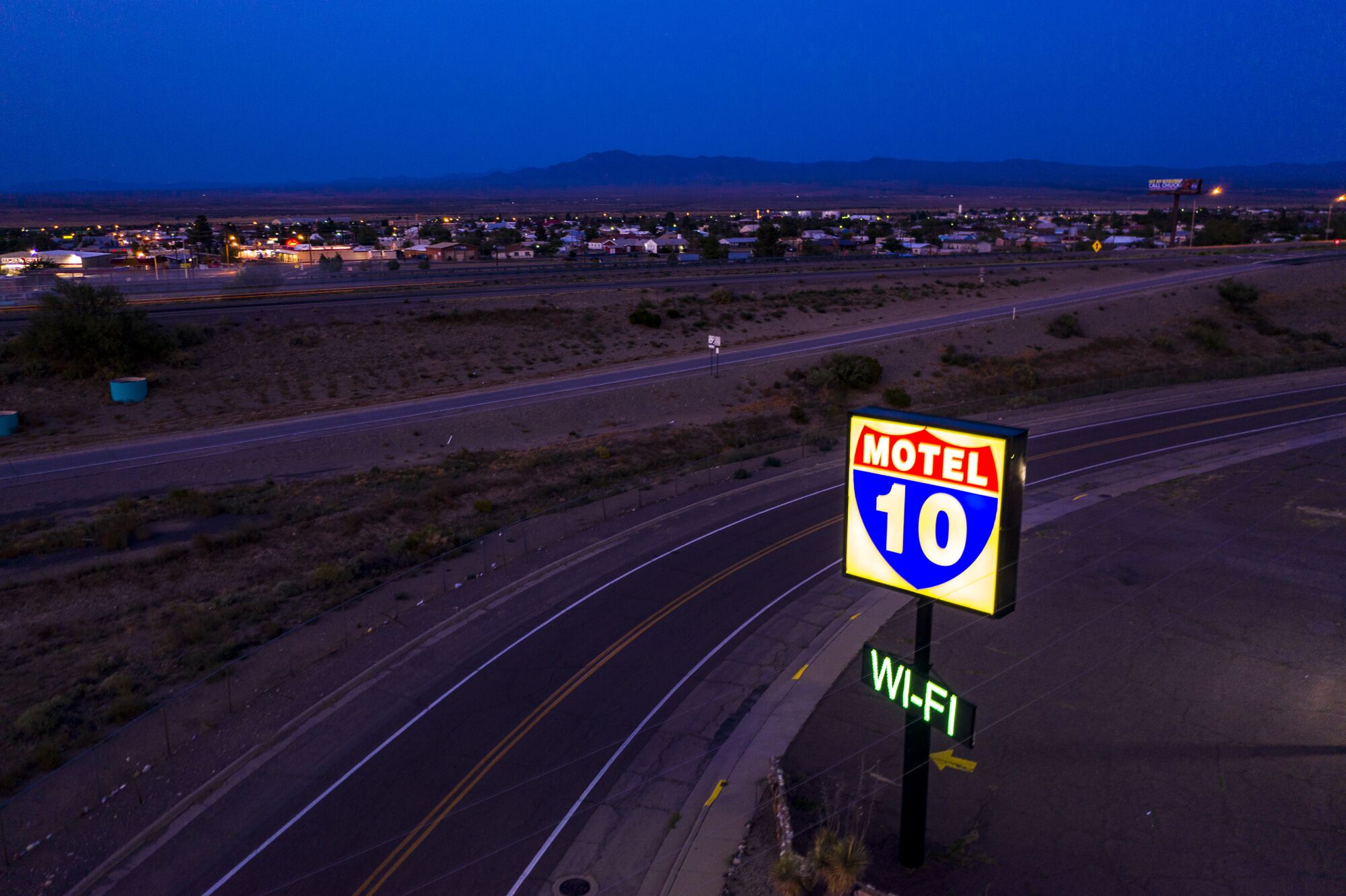 The town of Lordsburg, N.M., glows a short distance from Interstate 10.