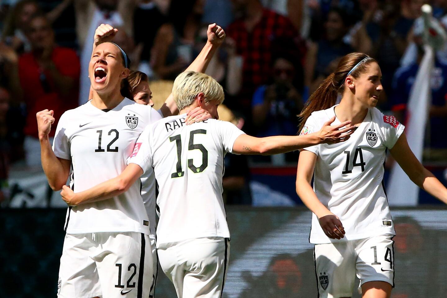 VANCOUVER, BC - JULY 05: Lauren Holiday #12 and Megan Rapinoe #15 of the United States celebrate after Holiday scores her first goal in the first half against Japan in the FIFA Women's World Cup Canada 2015 Final at BC Place Stadium on July 5, 2015 in Vancouver, Canada. (Photo by Ronald Martinez/Getty Images) ** OUTS - ELSENT, FPG - OUTS * NM, PH, VA if sourced by CT, LA or MoD **