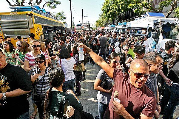 Thousands of food lovers attend the LA Street Food Fest in downtown L.A., an event featuring 30 of the city's most popular food trucks.