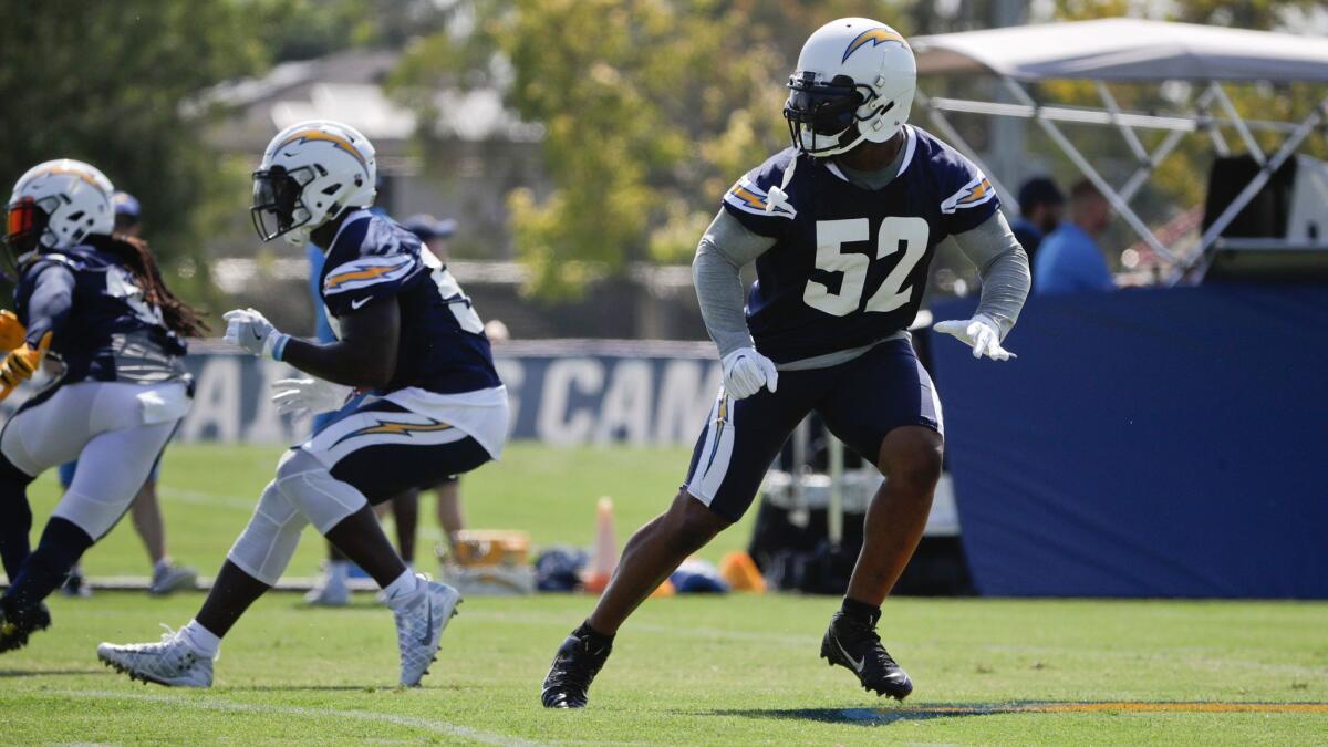 Chargers inside linebacker Denzel Perryman runs a drill at training camp in Costa Mesa on July 30.