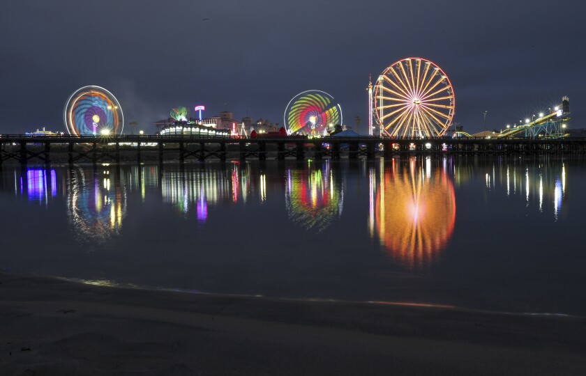 Lights from the rides at the San Diego County Fair are reflected on the San Dieguito River.