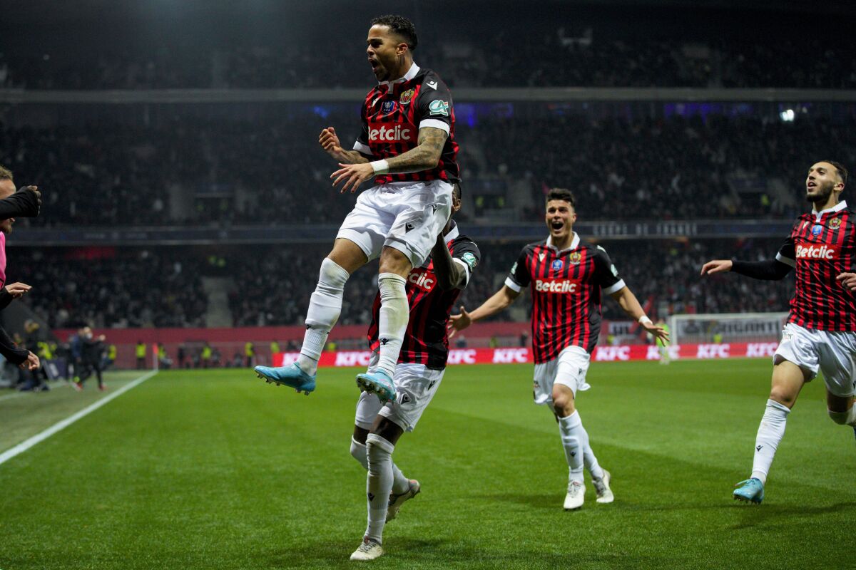 Nice's Justin Kluivert celebrates after scoring his side's third goal during the French Cup quarter final soccer match between Nice and Marseille at the Allianz Riviera stadium in Nice, France, Wednesday, Feb. 9, 2022. (AP Photo/Daniel Cole)