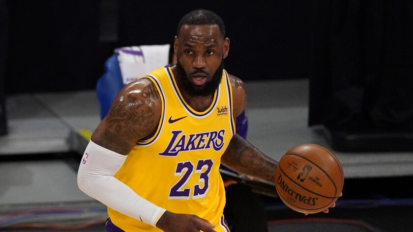 Lakers forward LeBron James dribbles.