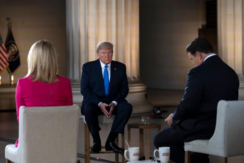 US President Donald Trump gestures as he speaks during a Fox News virtual town hall "America Together: Returning to Work," event, with anchors Bret Baier (R) and Martha MacCallum (L), from the Lincoln Memorial in Washington, DC on May 3, 2020. - Trump will answer questions submitted by viewers on Twitter, Facebook and Instagram.