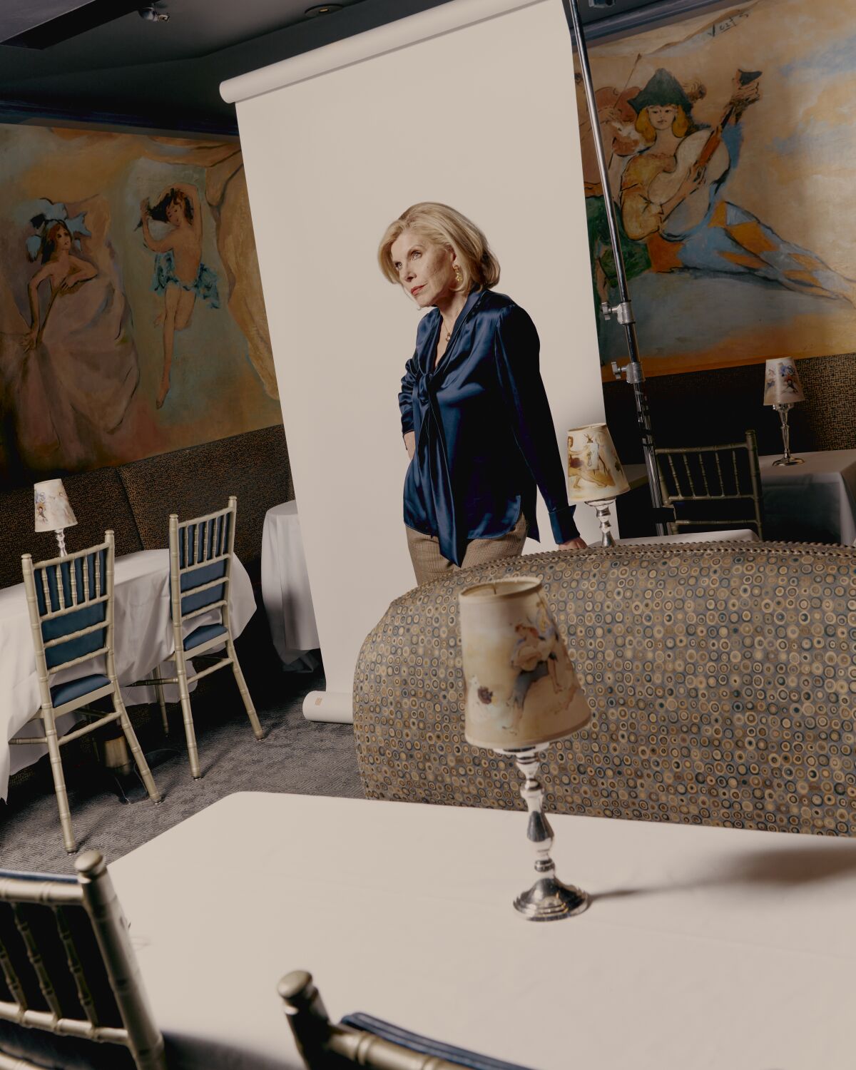 Christine Baranski poses for a portrait among the tables at Cafe Carlyle. 