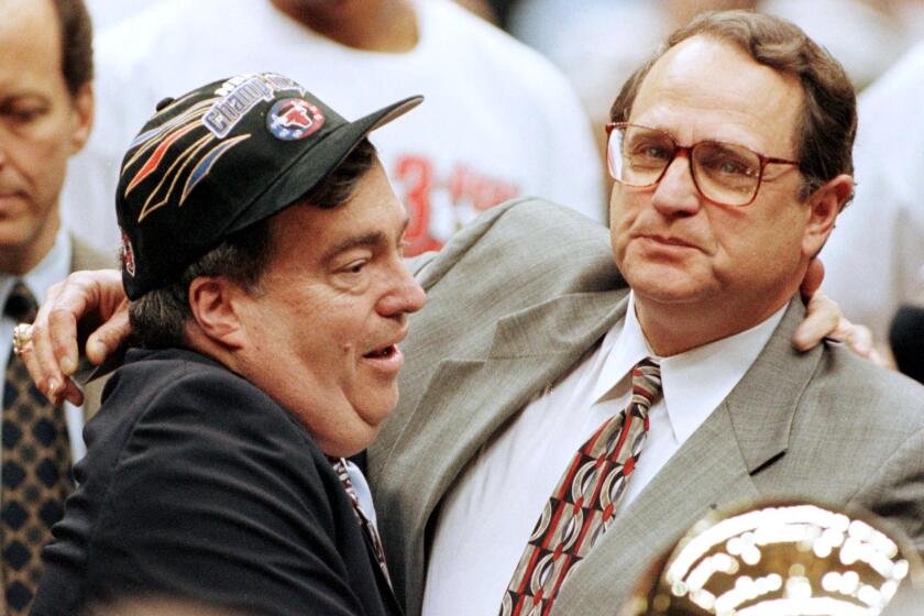 SALT LAKE CITY, UNITED STATES: Chicago Bulls General Manager Jerry Krause (L) and team owner Jerry Reinsdorf (R) celebrate14 June after the Bulls won game six of the NBA Finals against the Utah Jazz at the Delta Center in Salt Lake City, UT. The Bulls won the game 87-86 for their sixth NBA Championship. AFP PHOTO/Jeff HAYNES (Photo credit should read JEFF HAYNES/AFP via Getty Images)