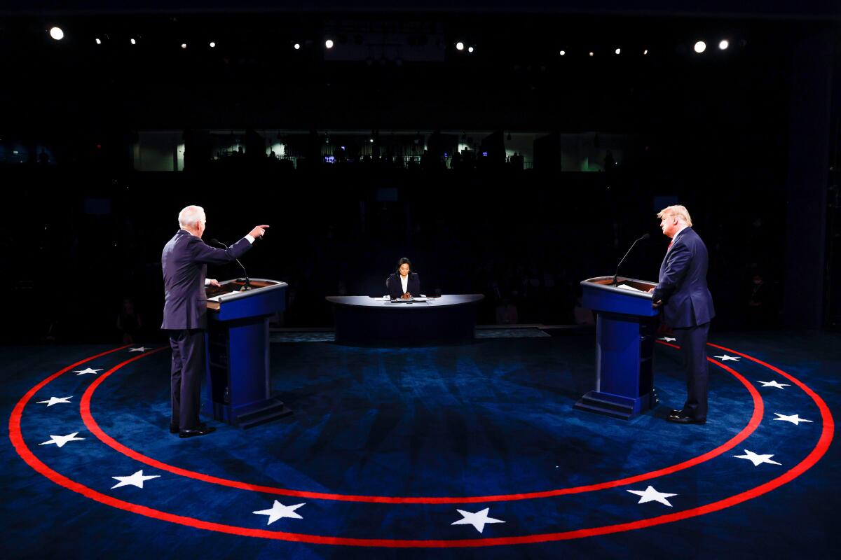Joe Biden, left, President Trump and moderator Kristen Welker on stage during the final presidential debate on Oct. 22. 