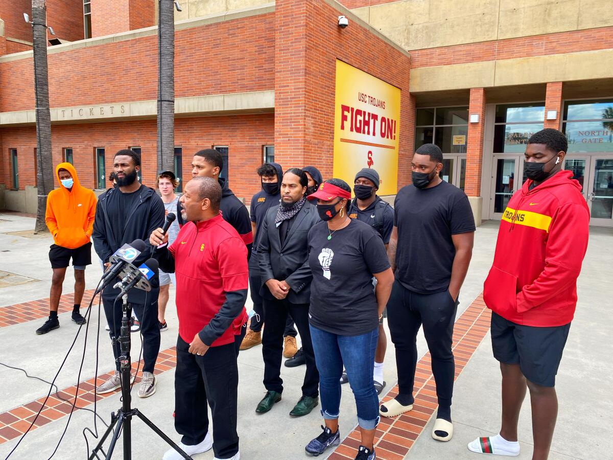 Local civil rights activist Najee Ali speaks at a news conference for suspended USC player Munir McClain