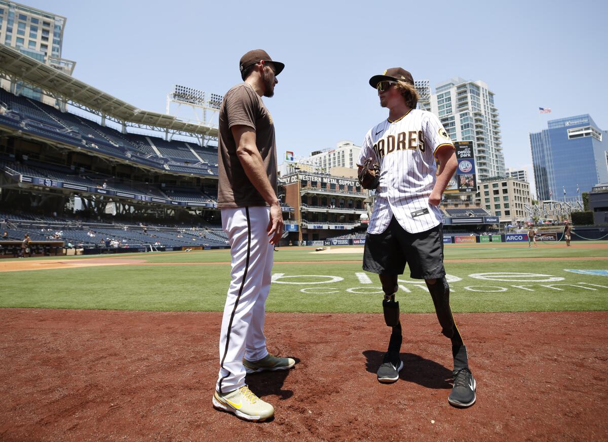 Padres' pitcher Joe Musgrove talks with Landis Sims 