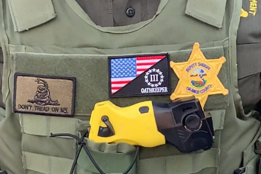 CAIR-L.A. on Wednesday called on O.C. sheriff's officials to investigate a deputy seen at a Costa Mesa protest wearing an insignia for an extremist group.