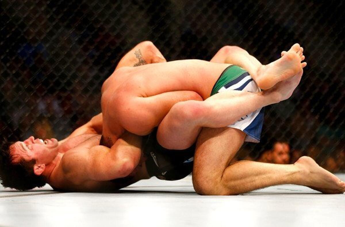 Chael Sonnen forces Mauricio Rua to tap out during a UFC light-heavyweight fight on Saturday night in Boston.
