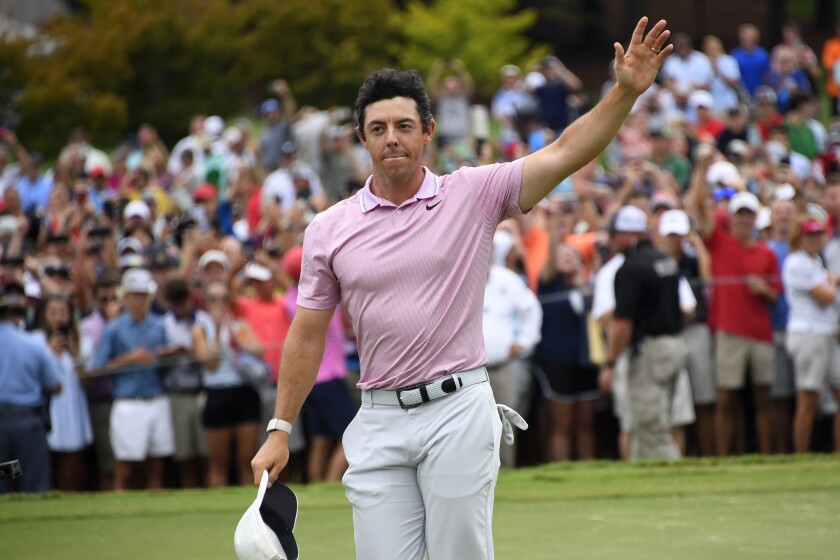 Rory McIlroy waves to the gallery after winning Sunday.
