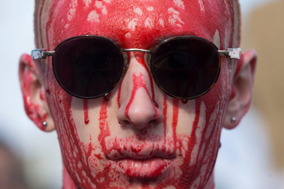 WASHINGTON: A young man covered his head in fake blood for Saturday's March for Our Lives.