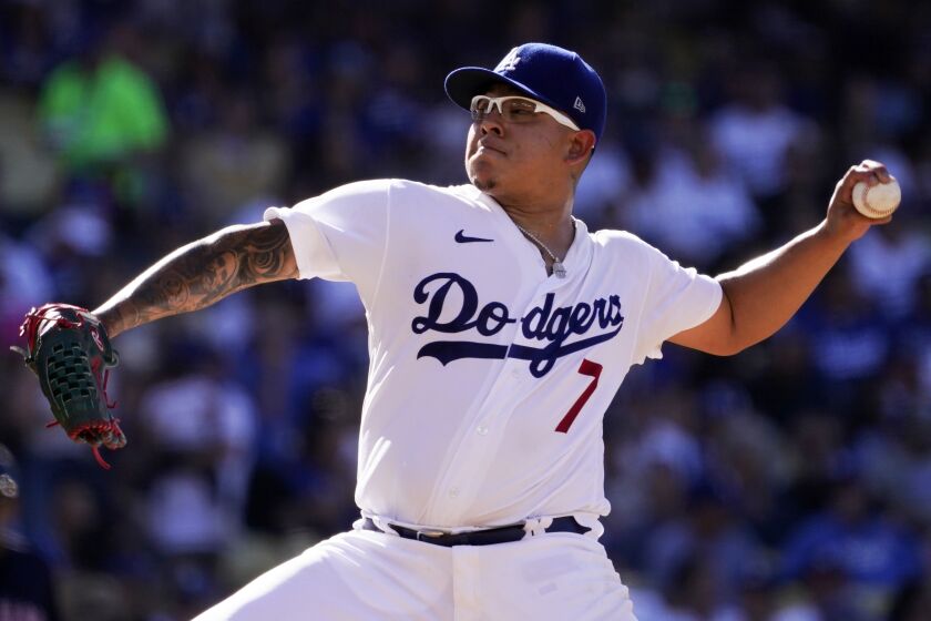 Los Angeles Dodgers starting pitcher Julio Urias throws to the plate during the second inning.