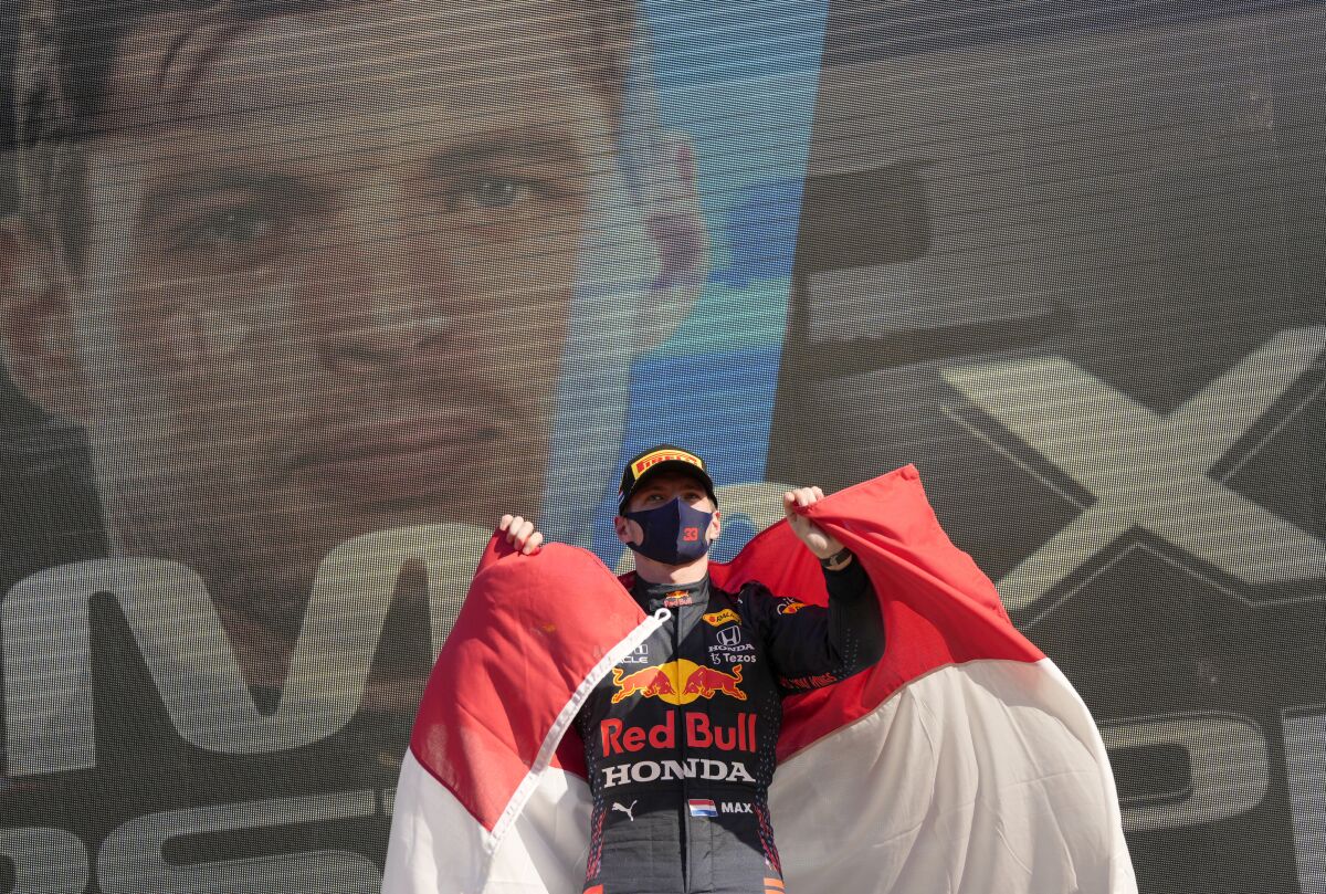 Red Bull driver Max Verstappen of the Netherlands celebrates on the podium after winning the Formula One Dutch Grand Prix, at the Zandvoort racetrack, Netherlands, Sunday, Sept. 5, 2021. (AP Photo/Francisco Seco)